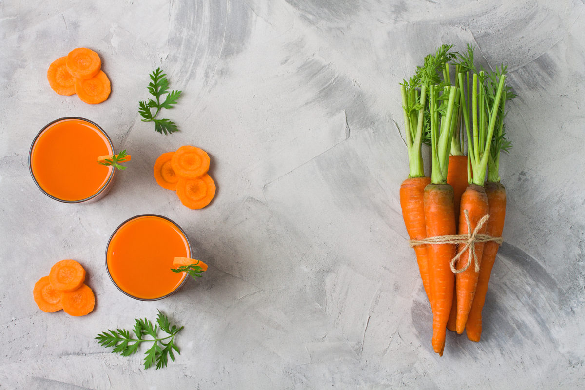 bigstock-Bunch-Of-Carrot-With-Green-Tw-244688536-1200x800.jpg